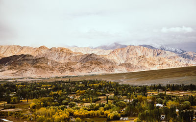 Scenic view of landscape and mountains against sky