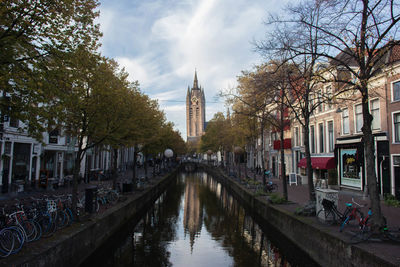 Panoramic view of canal amidst buildings against sky