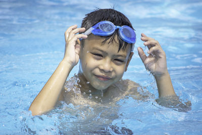 Portrait of boy in swimming pool