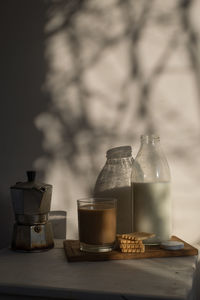 Coffee beans in glass on table