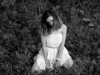 Young woman standing on field