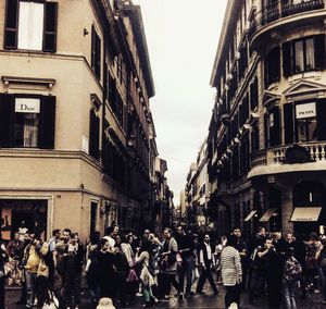 Crowd on street in city