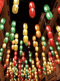 Low angle view of illuminated lanterns hanging at night