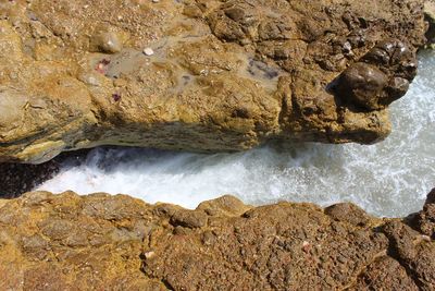 Scenic view of sea waves splashing on rocks