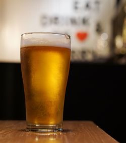 Close-up of beer glass on table