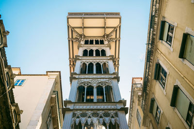 Low angle view of building against blue sky