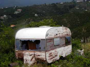 Abandoned car on field
