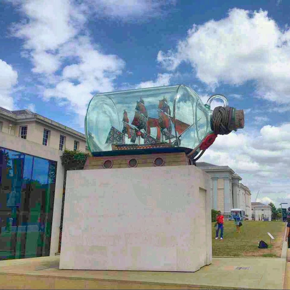 architecture, building exterior, built structure, sky, cloud - sky, low angle view, cloudy, cloud, incidental people, day, old, outdoors, art and craft, art, building, history, street, city, sunlight, travel