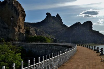 Scenic view of mountains against cloudy sky