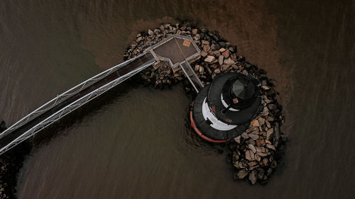 High angle view of metal on table against wall