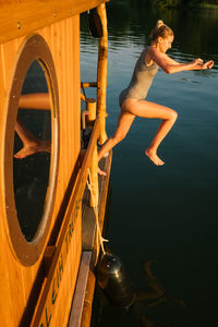 Young woman jumping in sea