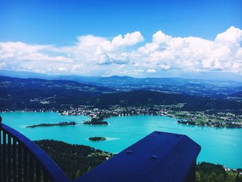 Scenic view of swimming pool by lake against sky