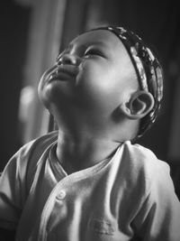 Close-up portrait of boy looking away at home