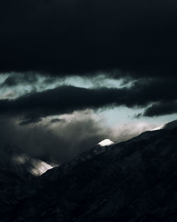 Scenic view of mountain against dramatic sky