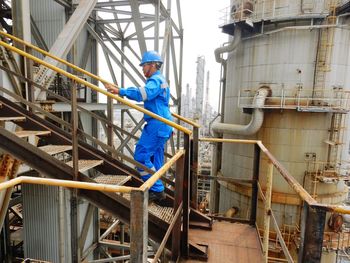 Rear view of man working at construction site