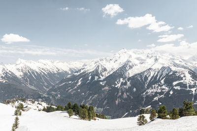 Scenic view of snowcapped mountains against sky during winter