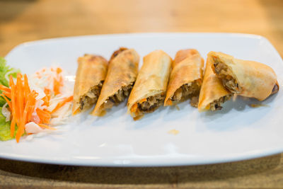 Close-up of serving food in plate