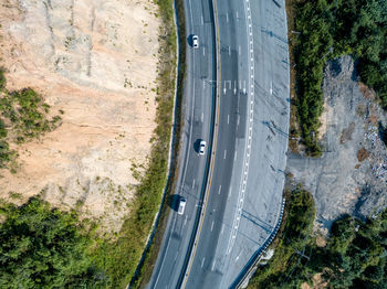 High angle view of road amidst trees in city