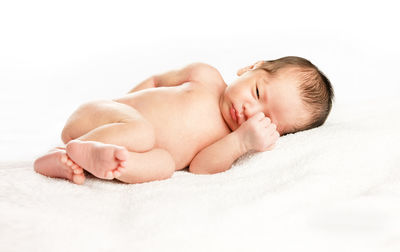 Cute baby sleeping on bed