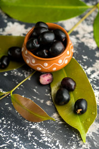 High angle view of black fruits on table