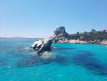 Scenic view of sea against clear blue sky