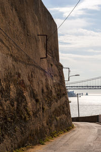 Bridge over sea against sky