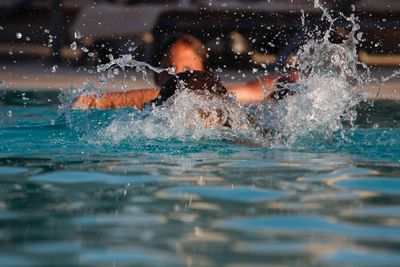 Man swimming in pool
