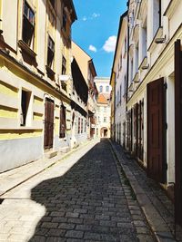 Narrow alley amidst buildings in city