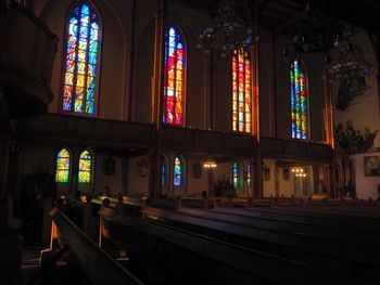 Illuminated building seen through glass window