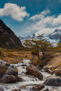 Scenic view of snowcapped mountains against sky