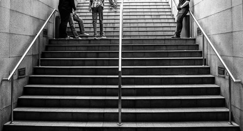 Low section of people standing on stairs