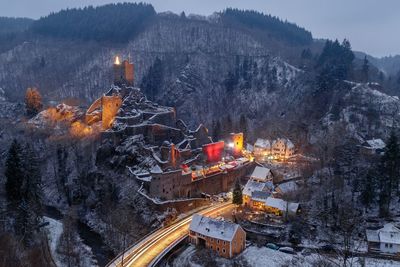 High angle view of illuminated town during winter