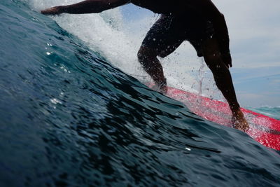 Man splashing water in sea