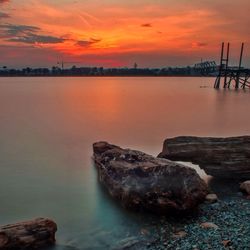 Scenic view of sea at sunset