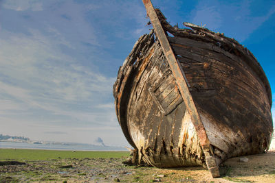 Damaged boat on beach