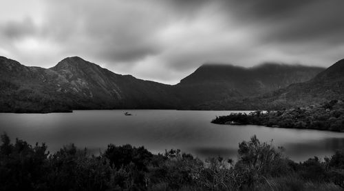 Scenic view of lake and mountains against sky