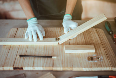 Low section of person working on table