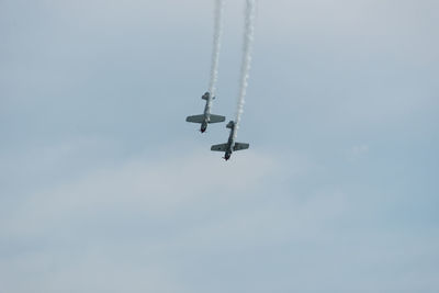 Low angle view of airplane flying in sky