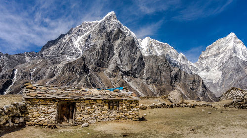 Panoramic view of snowcapped mountains against sky