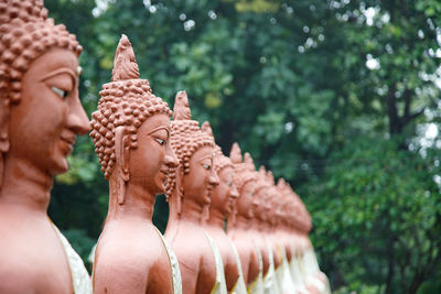 Low angle view of statue against trees