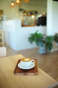 Coffee cup on table at cafe