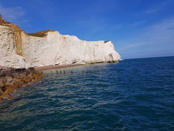 Scenic view of sea against blue sky