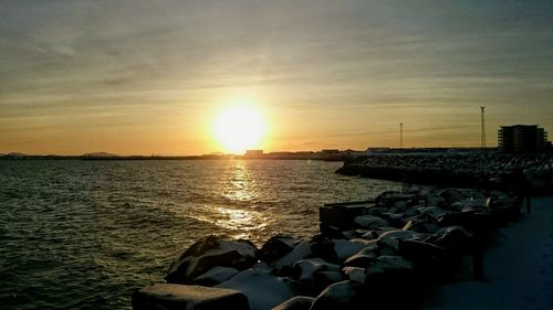 Scenic view of sea at sunset