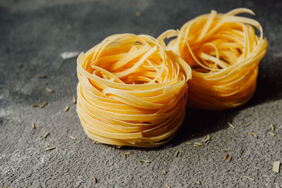 Close-up of yellow homemade noodle on table