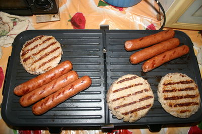 High angle view of meat on barbecue grill