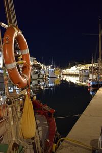 Boats moored at harbor