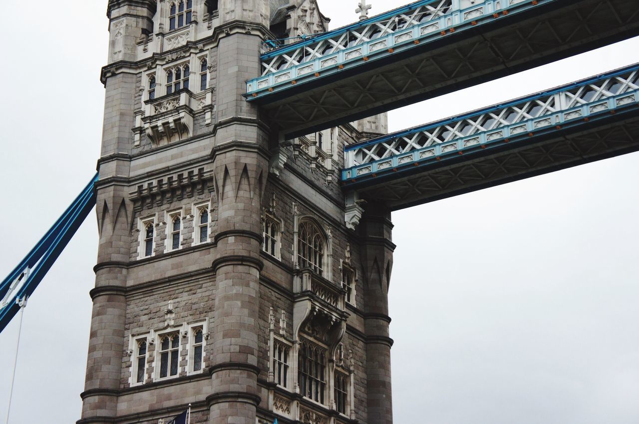 architecture, built structure, low angle view, famous place, international landmark, building exterior, travel destinations, capital cities, tourism, history, travel, city, clear sky, tower, architectural column, engineering, tall - high, connection, culture, bridge - man made structure