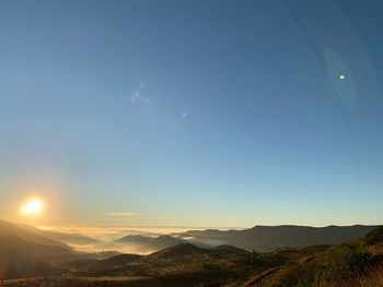 Scenic view of mountains against sky during sunset