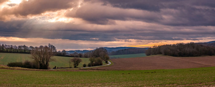 Scenic view of landscape against sky during sunset