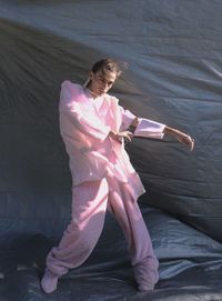 High angle view of woman photographing with umbrella